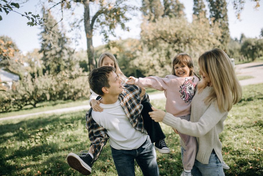 A family playing together outdoors