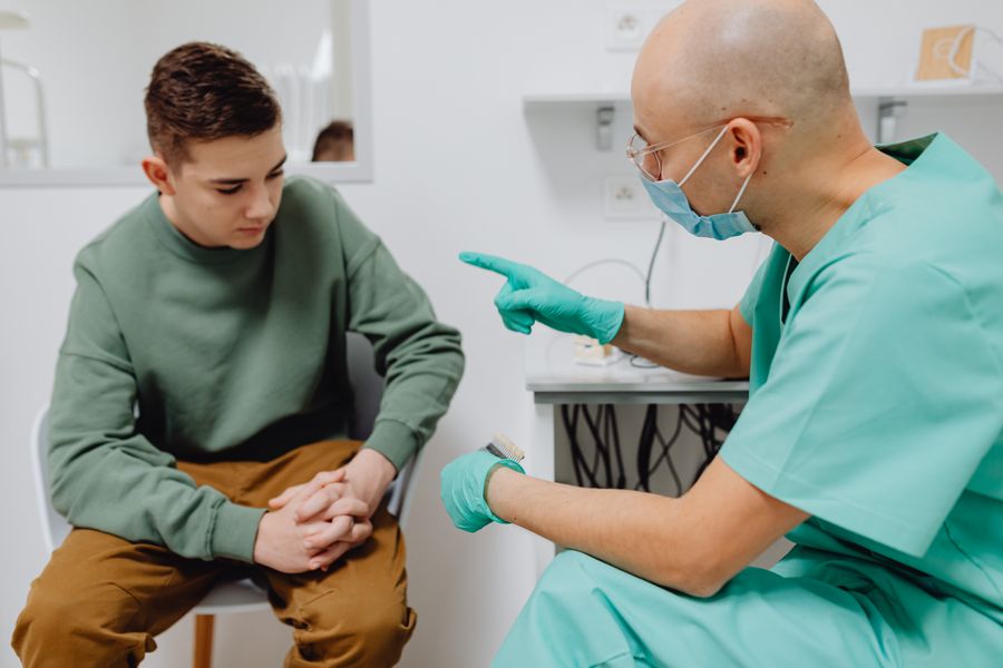 A teenager talking with a clinician