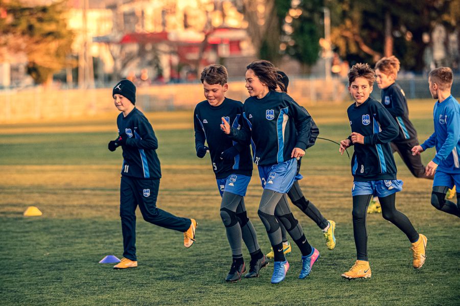 Kids running at soccer practice